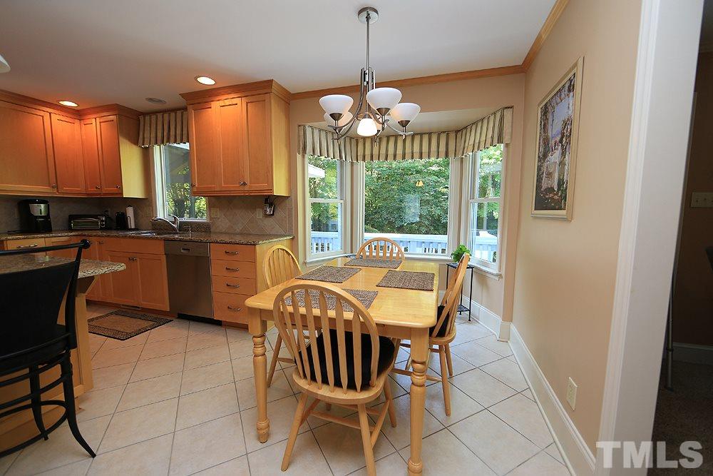 7905 Hardwick Drive Raleigh, NC 27615 - Photo 7 of 26 Easy care tile floors in the kitchen, bay window lets in natural light !
