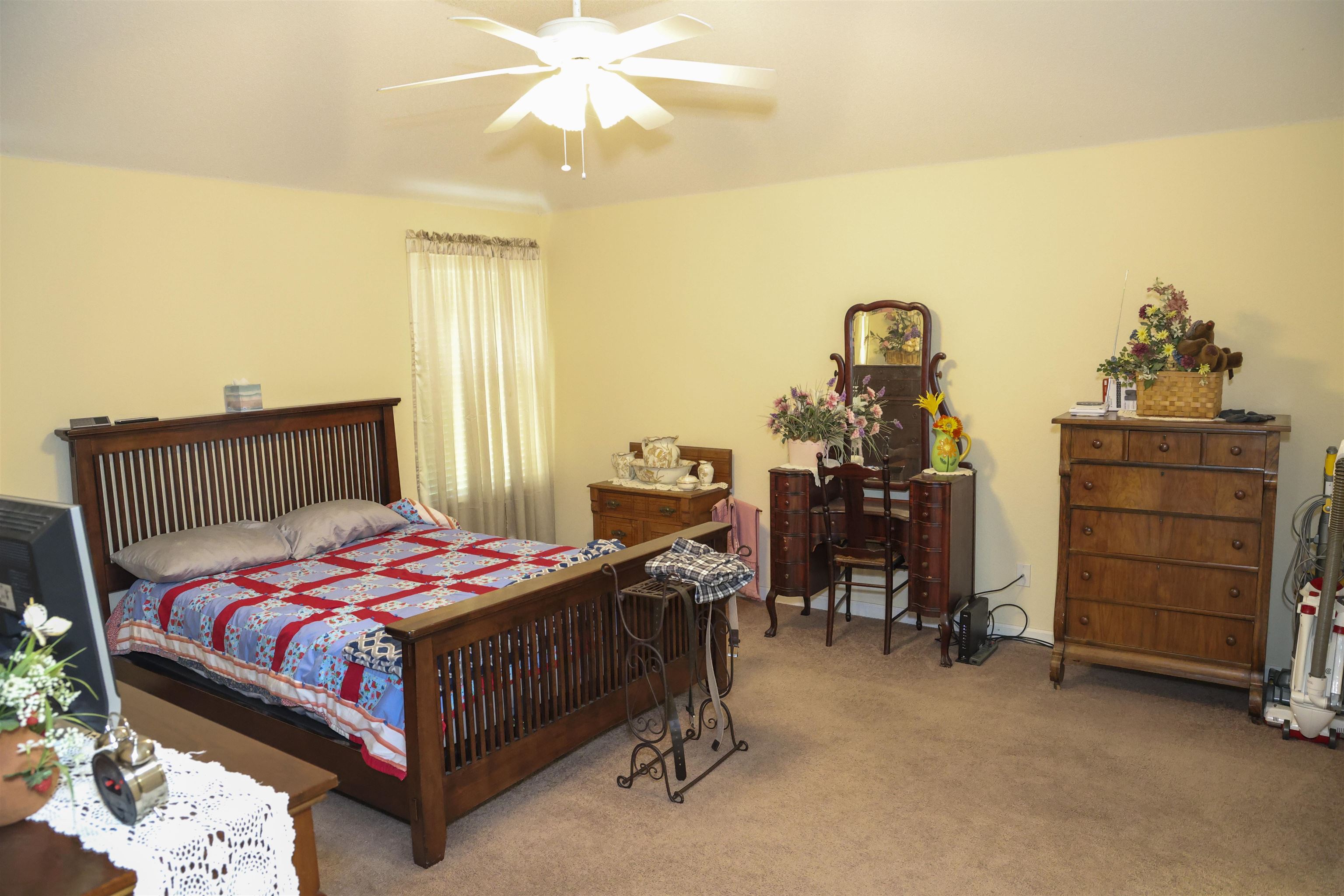 6626 Finch Road Memphis, TN 38141 - Photo 11 of 14 Spacious room featuring carpeting, light-toned walls, and a ceiling fan with light fixture