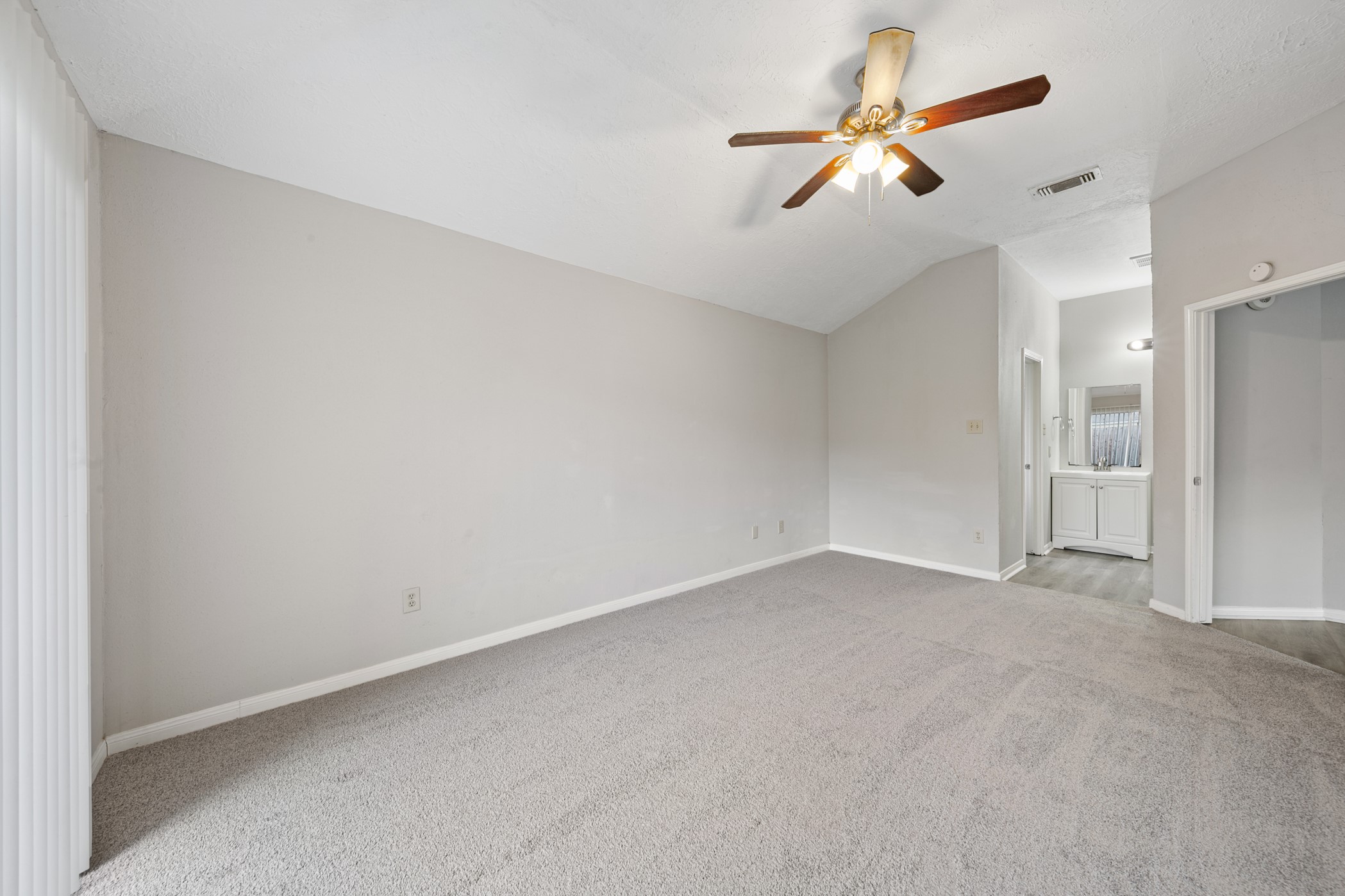 10530 Rippling Fields Drive Houston, TX 77064 - Photo 19 of 30 an empty room with closet and a chandelier fan