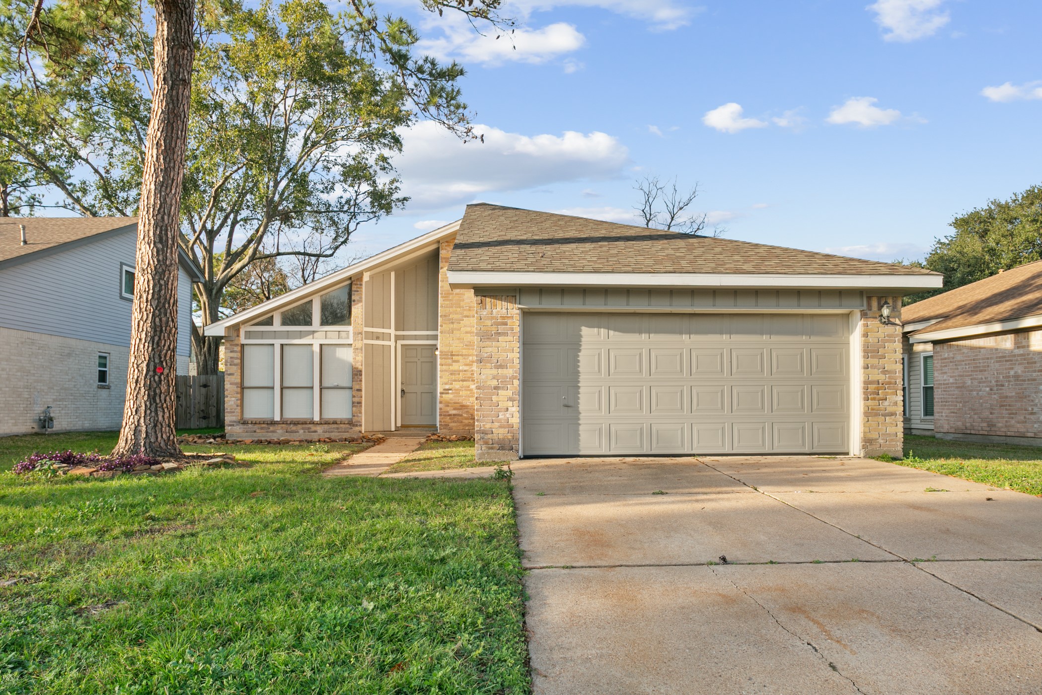 10530 Rippling Fields Drive Houston, TX 77064 - Photo 2 of 30 a front view of a house with garden