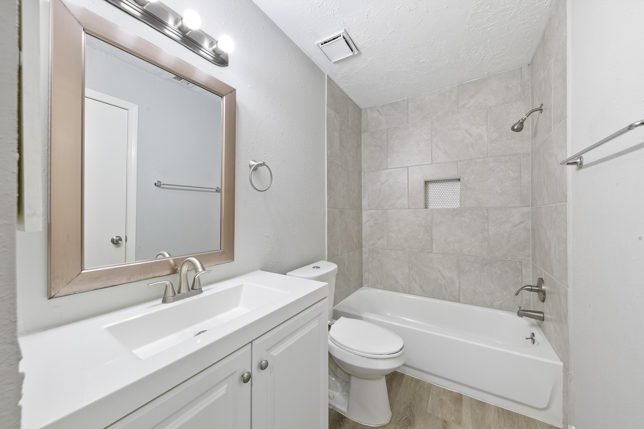 10530 Rippling Fields Drive Houston, TX 77064 - Photo 25 of 30 a bathroom with a sink a toilet and shower