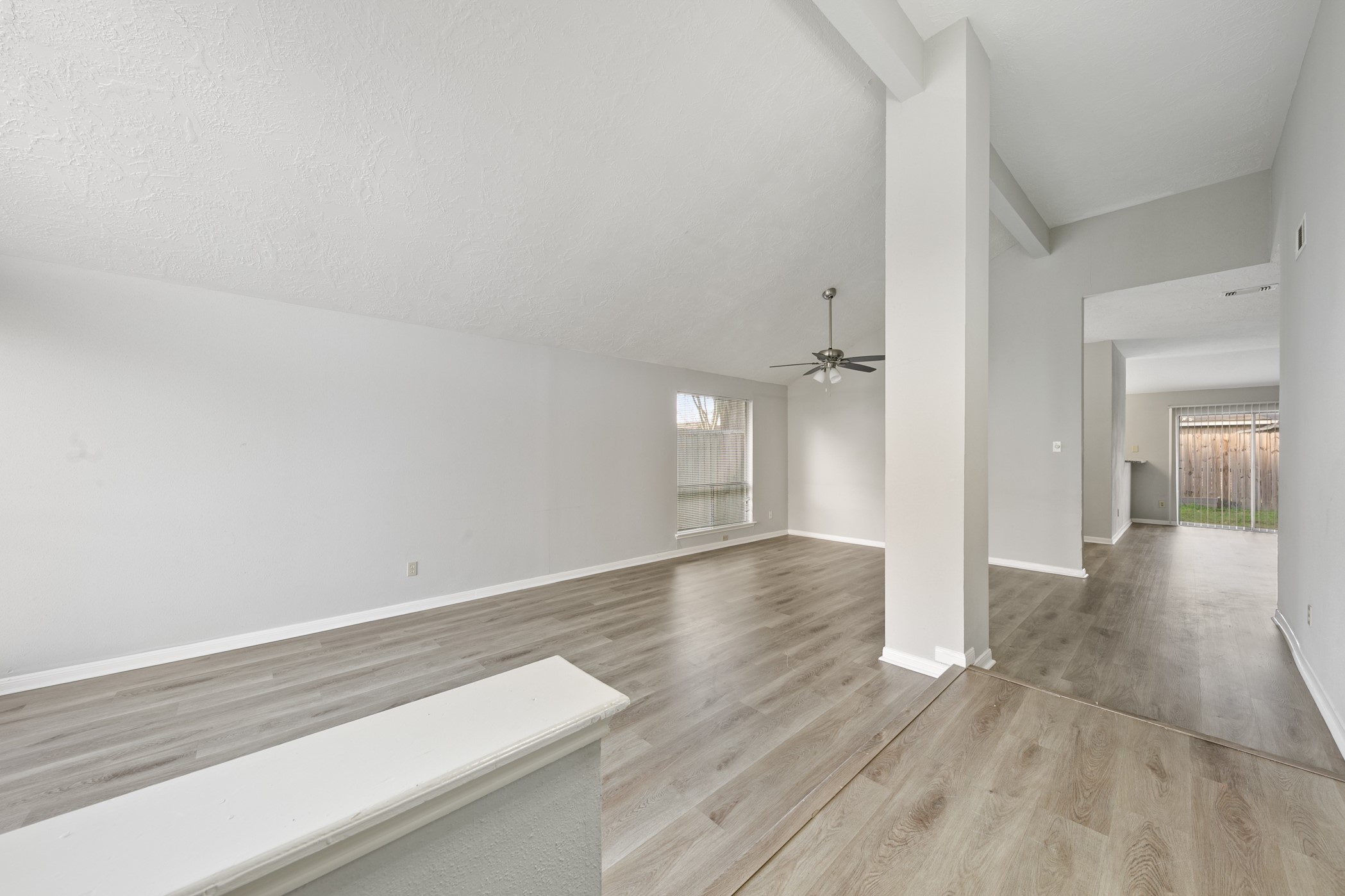 10530 Rippling Fields Drive Houston, TX 77064 - Photo 4 of 30 a view of an empty room and wooden floor