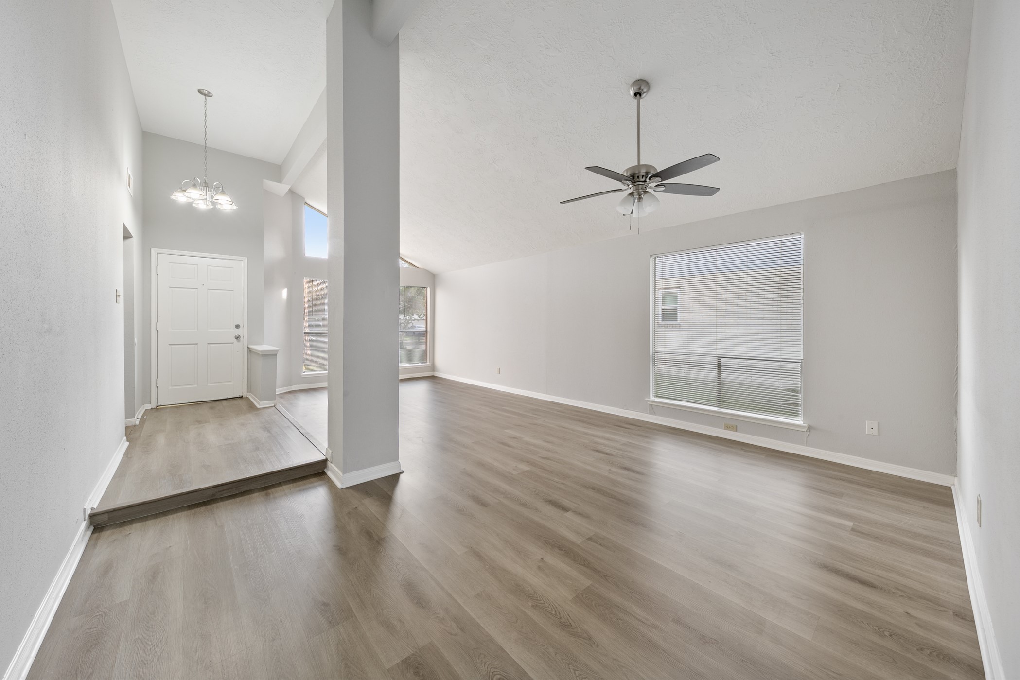 10530 Rippling Fields Drive Houston, TX 77064 - Photo 6 of 30 wooden floor in an empty room with a window