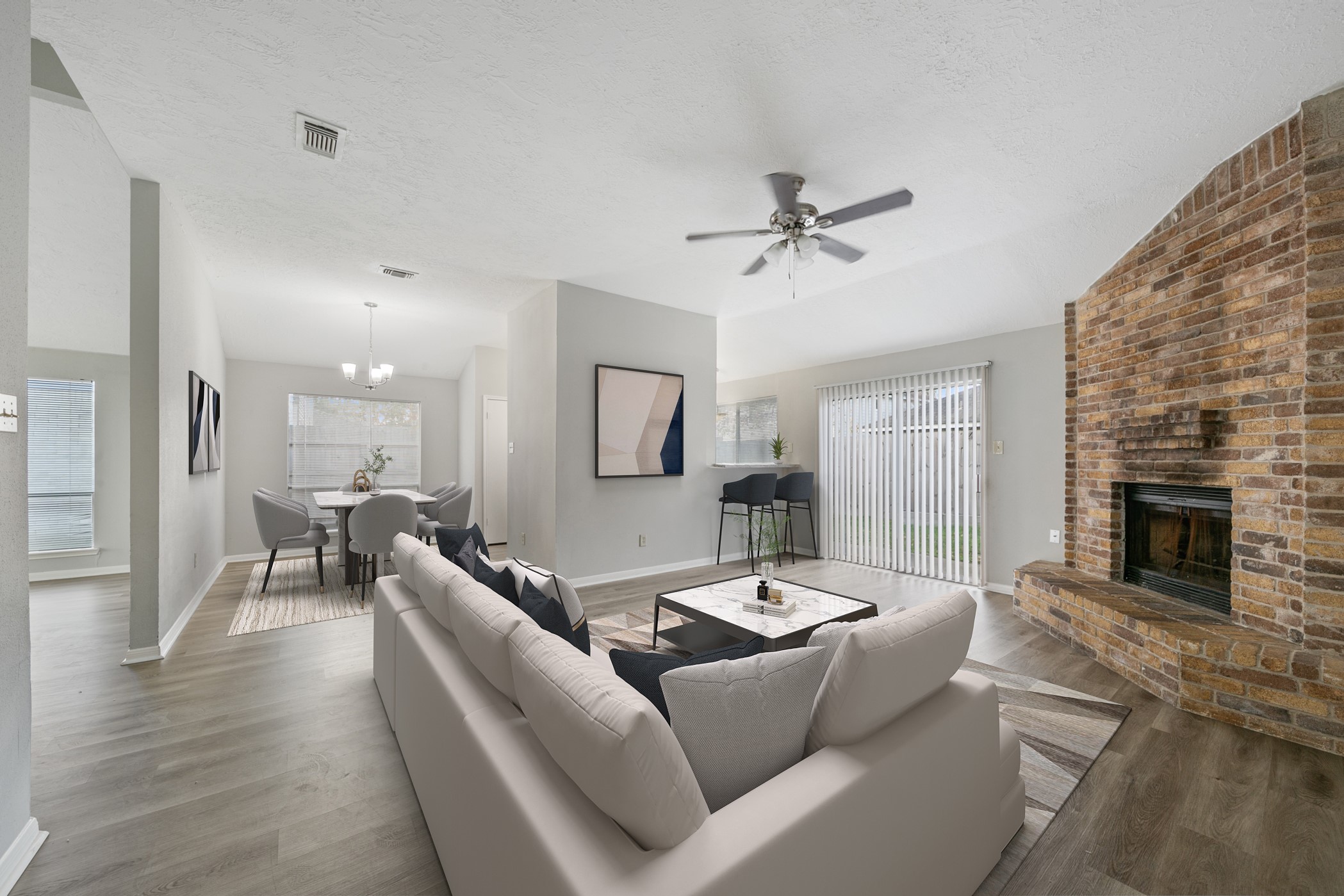 10530 Rippling Fields Drive Houston, TX 77064 - Photo 10 of 30 a living room with furniture dining table and a fireplace