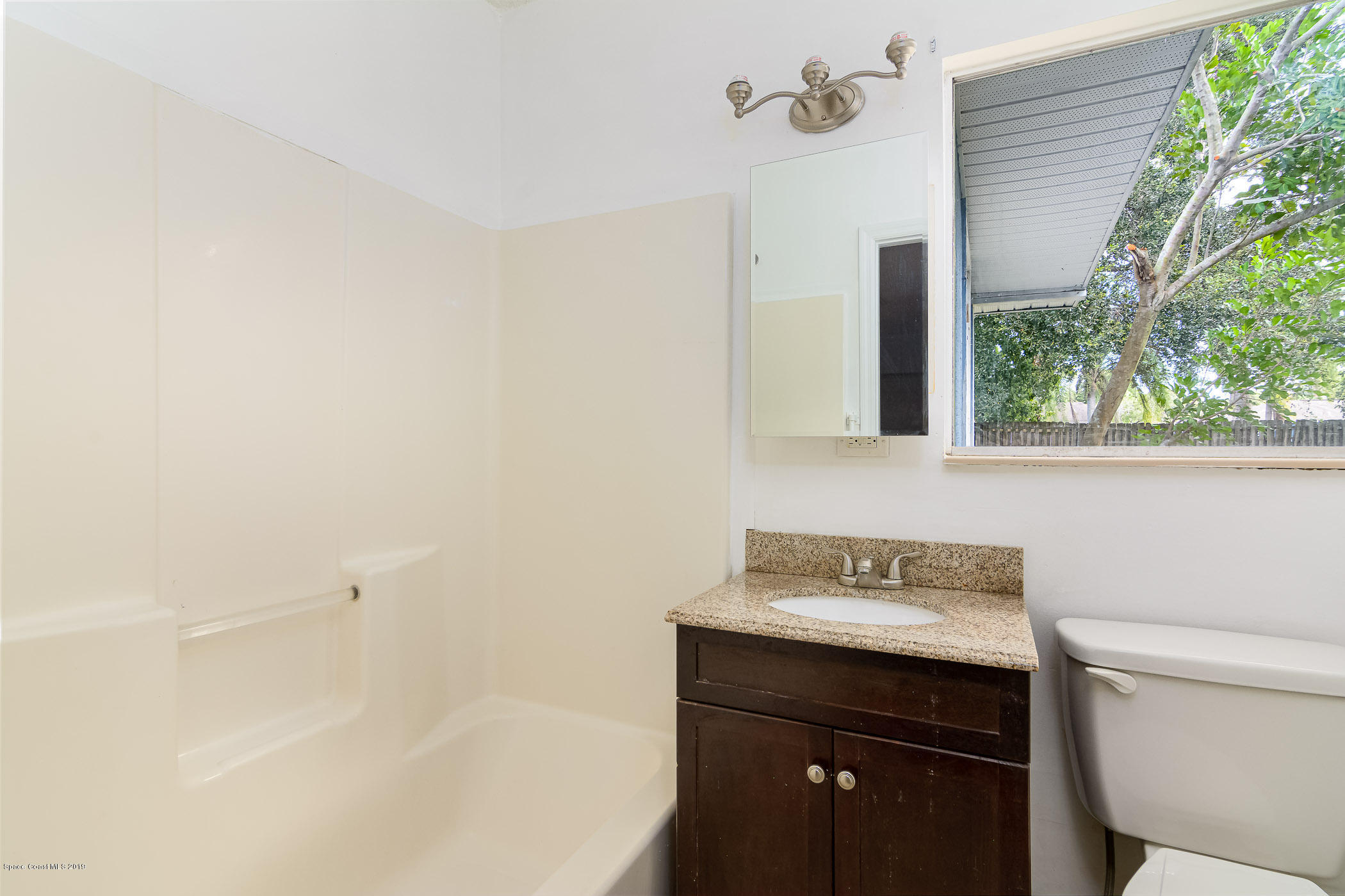 1111 Cotton Road Northeast Palm Bay, FL 32905 - Photo 15 of 27 MIL Bathroom