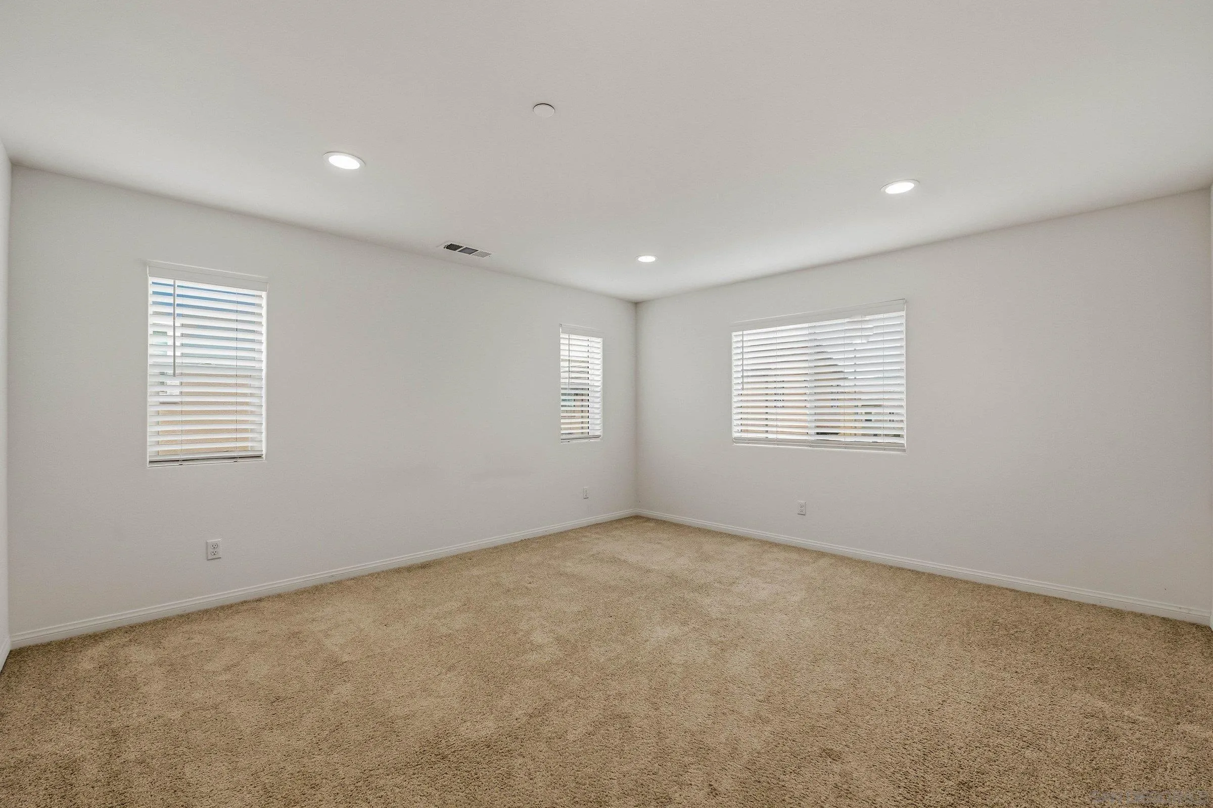 5429 Meridian Place Bonsall, CA 92003 - Photo 16 of 31 an empty room with windows