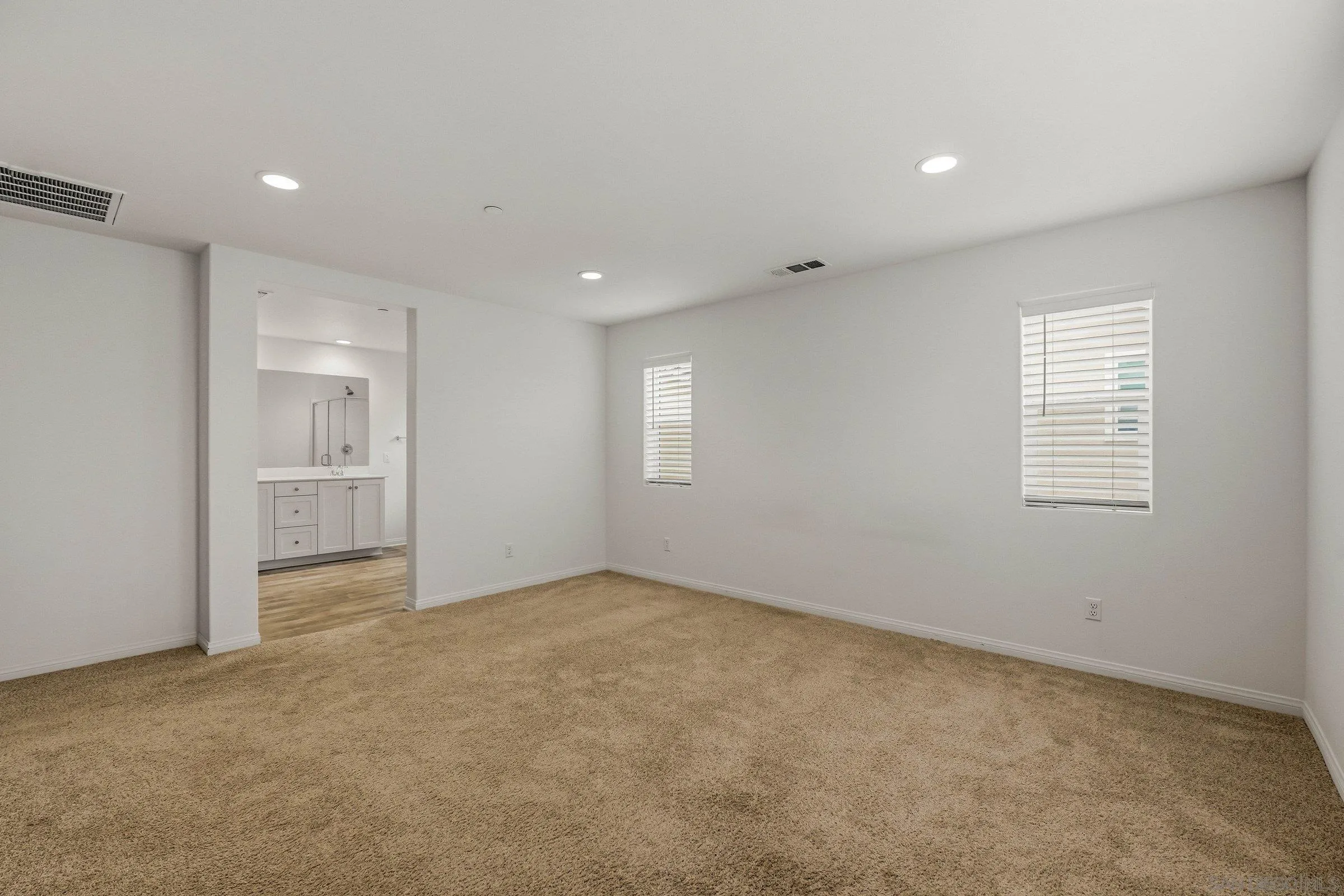 5429 Meridian Place Bonsall, CA 92003 - Photo 18 of 31 an empty room with windows