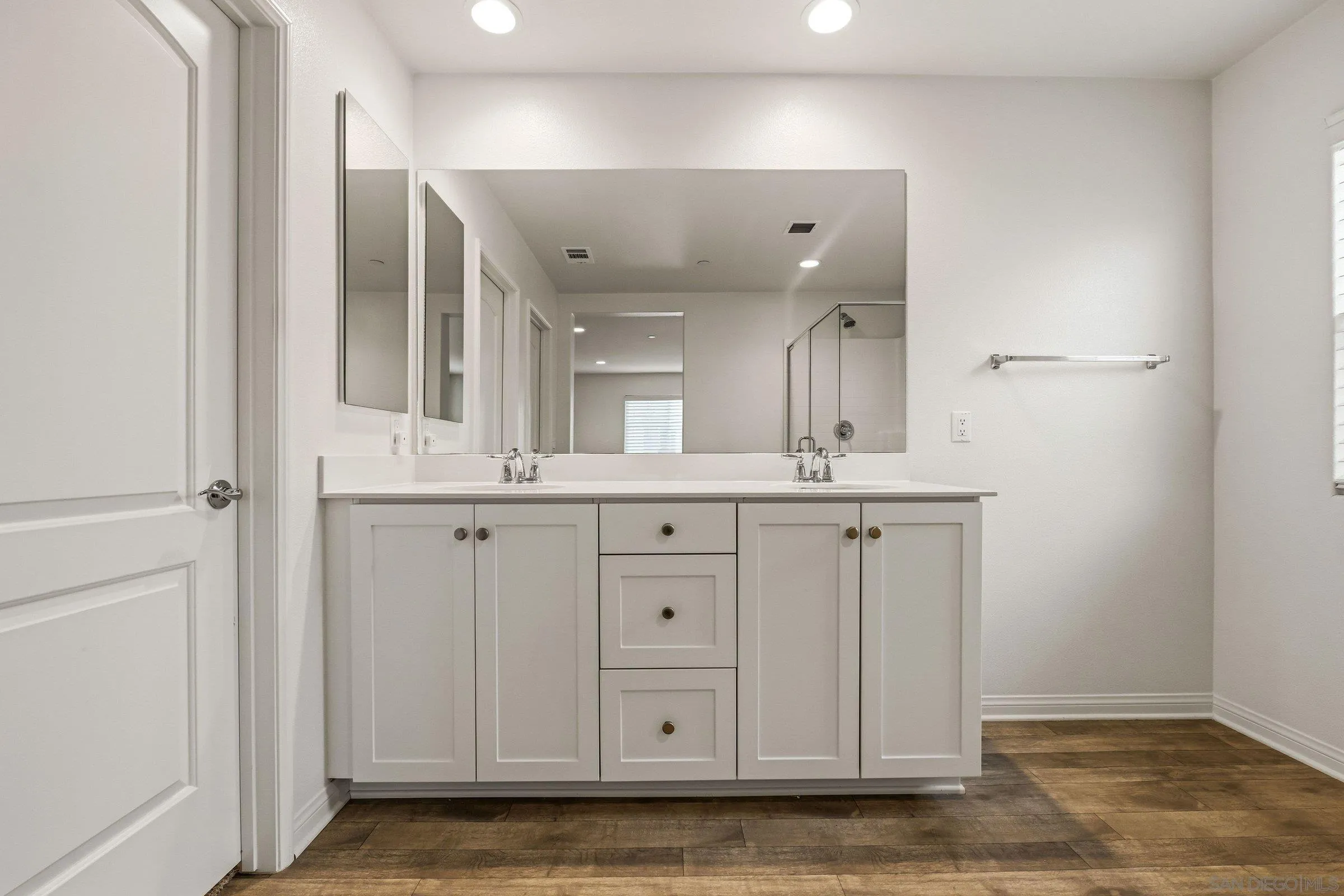 5429 Meridian Place Bonsall, CA 92003 - Photo 21 of 31 a bathroom with a granite countertop sink and a mirror