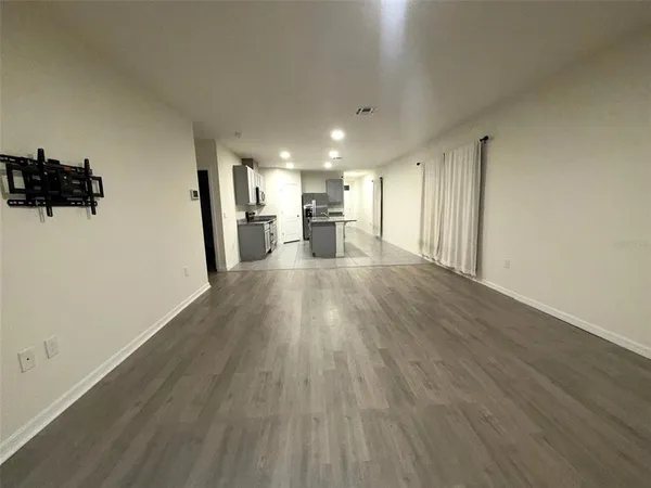 a view of a kitchen with a sink and cabinets