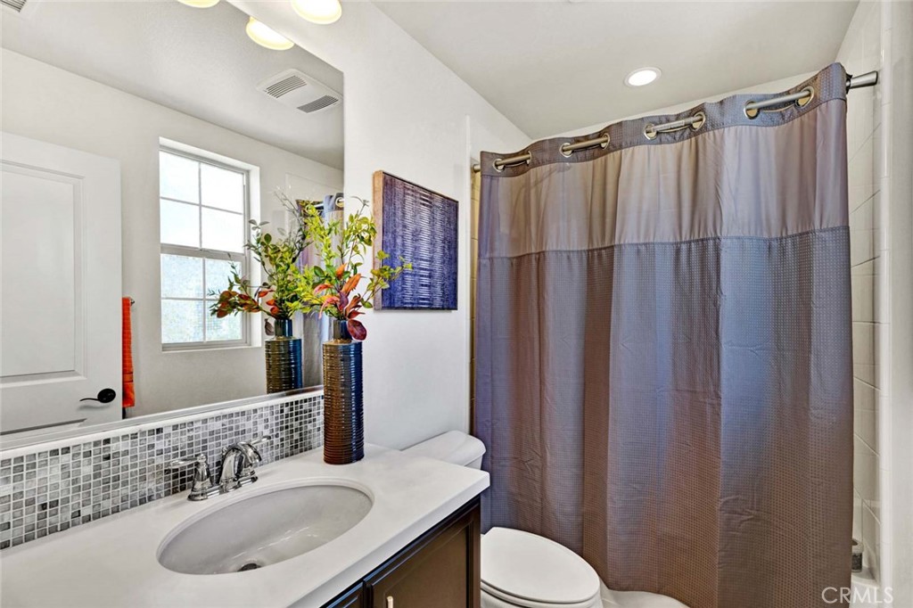 222 Barnes Road Tustin, CA 92782 - Photo 18 of 31 a bathroom with a sink toilet and shower