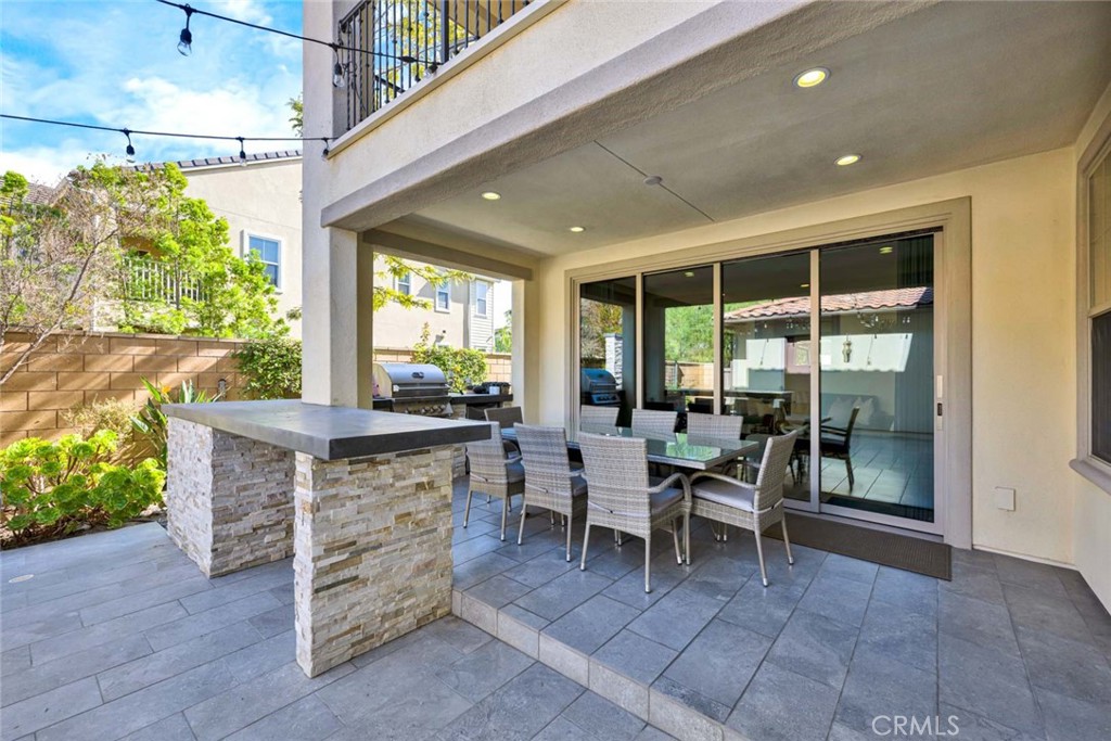 222 Barnes Road Tustin, CA 92782 - Photo 21 of 31 a dining room with furniture and a floor to ceiling window