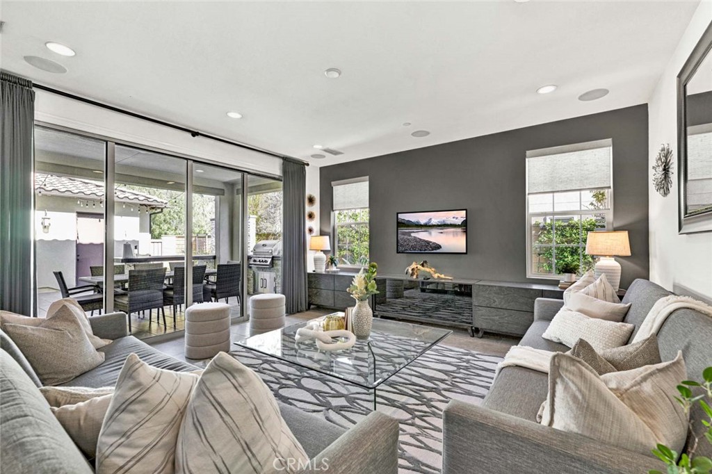 222 Barnes Road Tustin, CA 92782 - Photo 7 of 31 a living room with furniture or couch and a large window