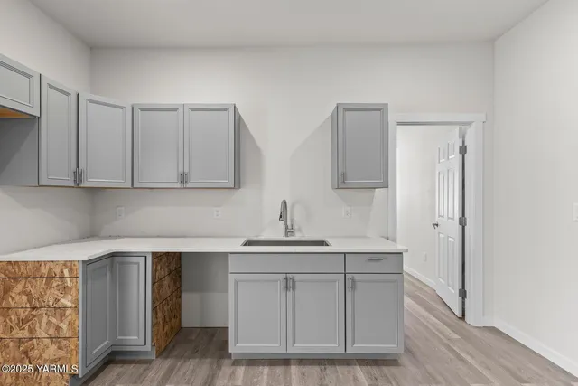a kitchen with white cabinets