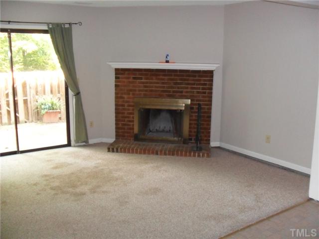 1304 Seaton Road, Unit T2 Durham, NC 27713 - Photo 4 of 8 a view of empty room with a fireplace