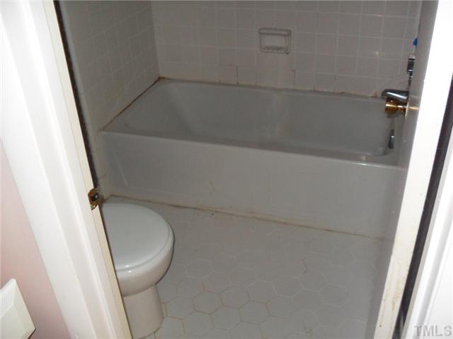 1304 Seaton Road, Unit T2 Durham, NC 27713 - Photo 7 of 8 a bathroom with a toilet and a shower