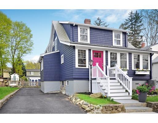 121 Overlook Road Arlington, MA 02474 - Photo 1 of 30 a front view of a house with a yard table and chairs