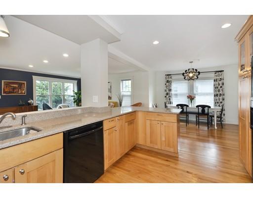 121 Overlook Road Arlington, MA 02474 - Photo 13 of 30 a kitchen with granite countertop a stove a sink a dining table and chairs