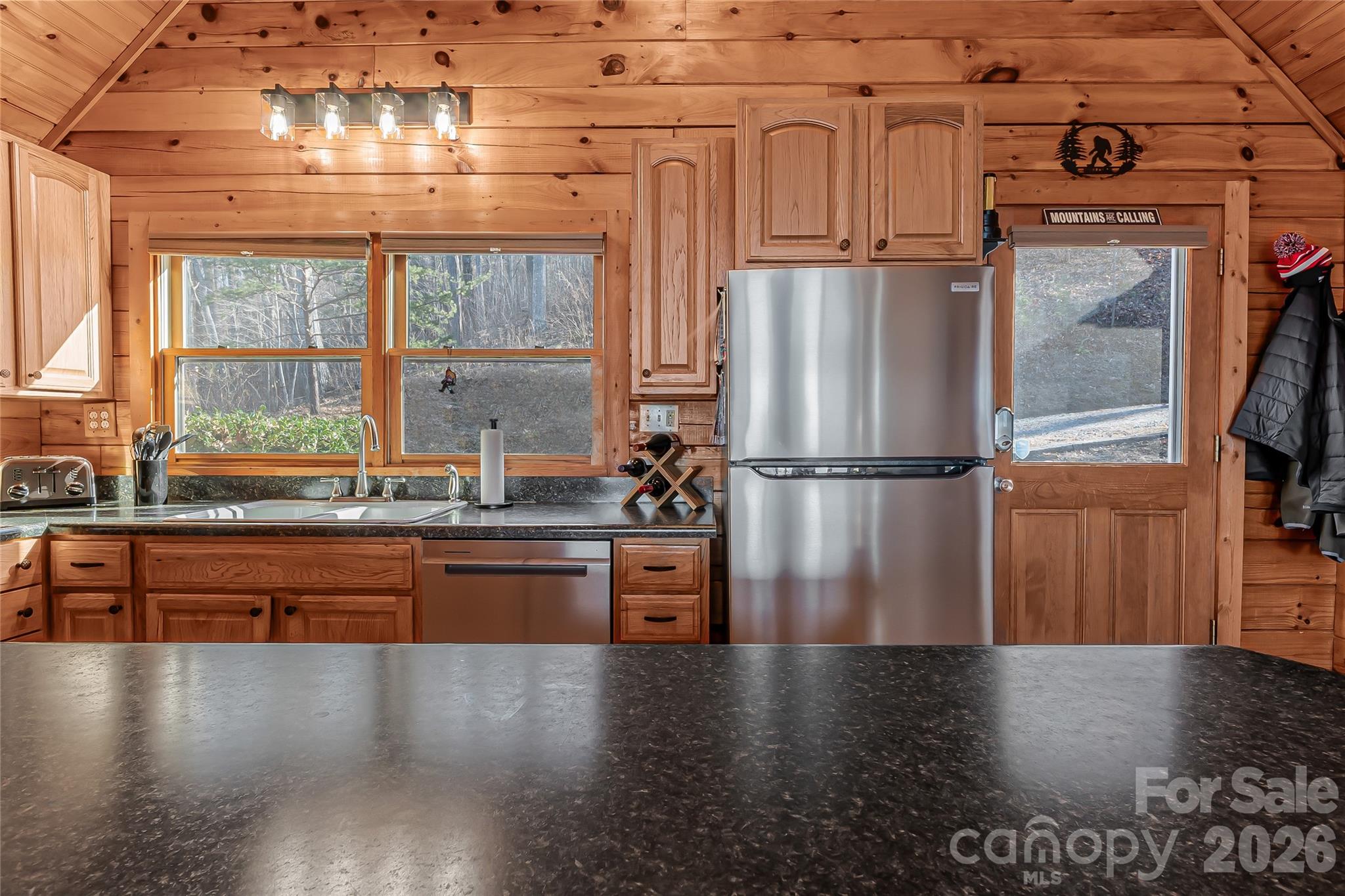 206 Amelia Lane Bostic, NC 28018 - Photo 21 of 48 a kitchen with stainless steel appliances granite countertop a refrigerator a stove and a wooden floors