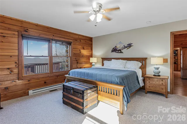 a spacious bedroom with a bed and a window