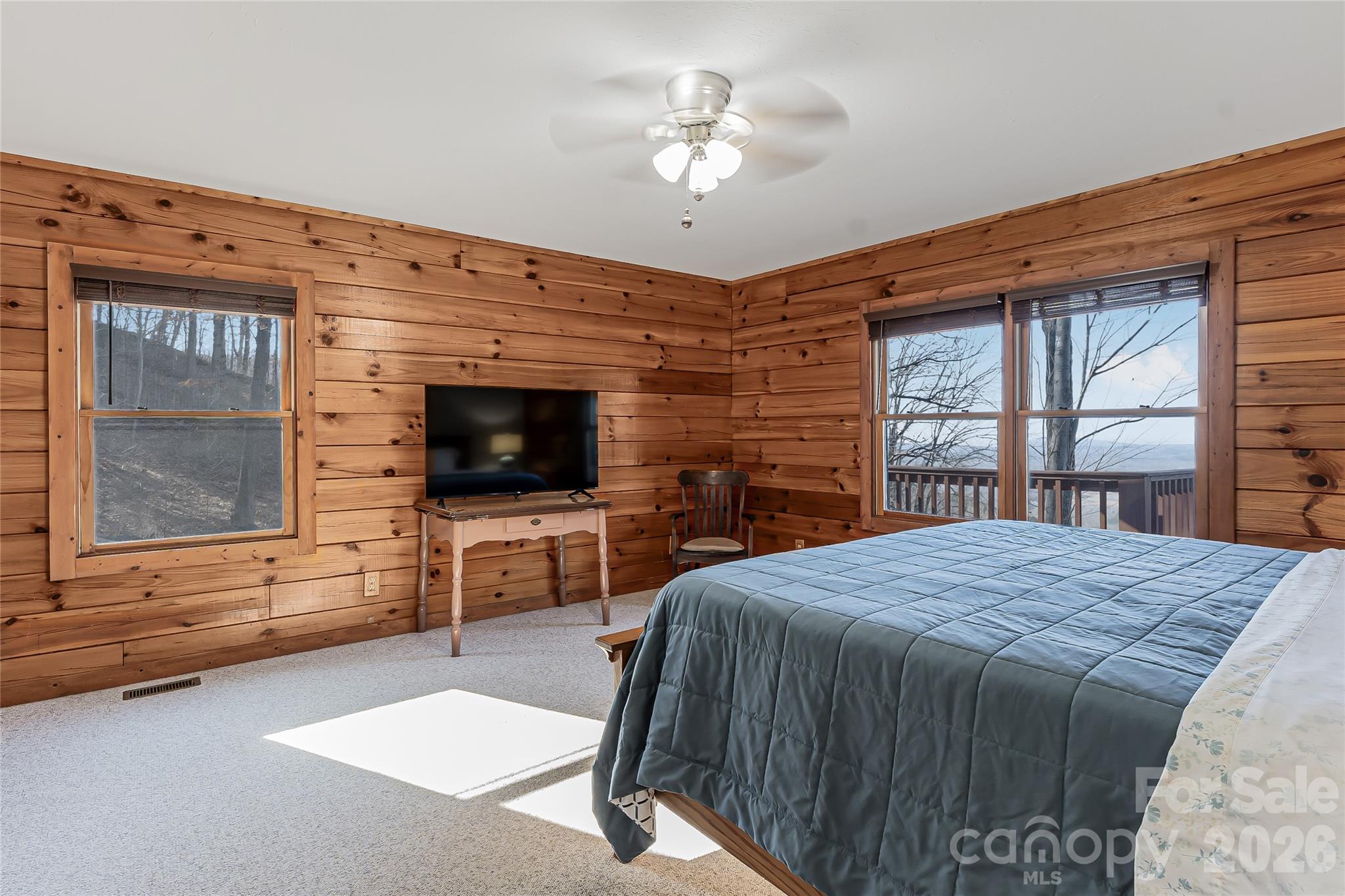 206 Amelia Lane Bostic, NC 28018 - Photo 26 of 48 a bedroom with a bed and a flat screen tv