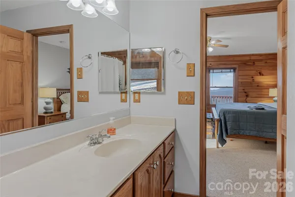 a en suite bathroom with a sink and a mirror