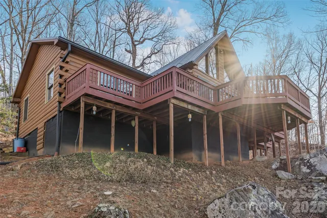 a view of a house with a yard and balcony