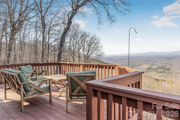 a view of balcony with furniture