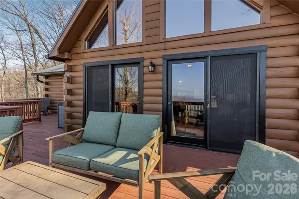 a outdoor living space with furniture and a fireplace