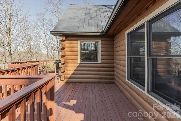 a view of a balcony with wooden floor