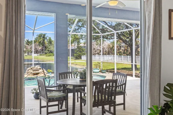 a view of a dining room with furniture window and outside view