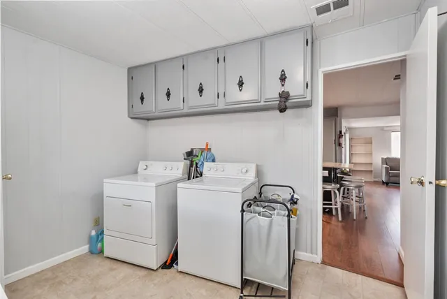 a bathroom with a granite countertop toilet sink and a mirror