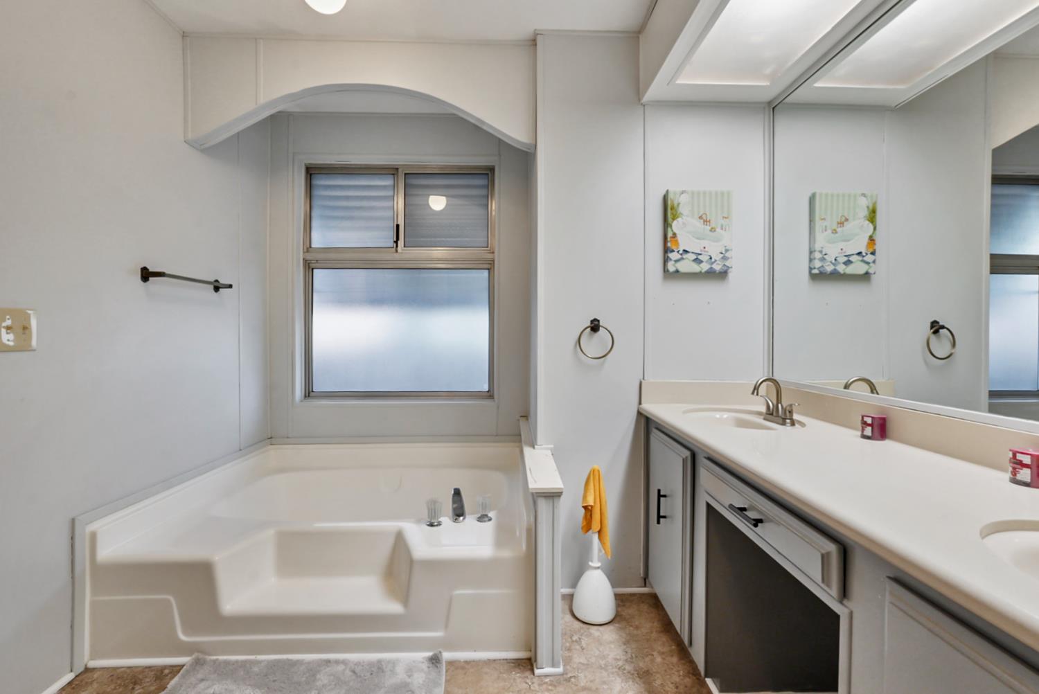 1400 North Tully Road, Unit 137 Turlock, CA 95380 - Photo 25 of 37 a bathroom with a sink and a mirror