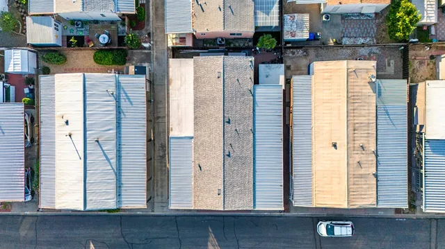 an aerial view of residential houses with outdoor space