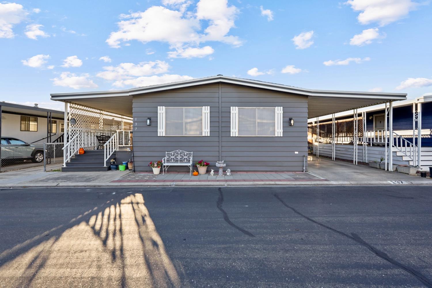 1400 North Tully Road, Unit 137 Turlock, CA 95380 - Photo 3 of 37 a front view of house with a garden
