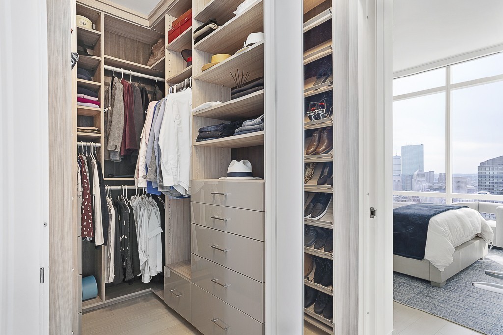 1 Franklin Street, Unit 3701 Boston, MA 02110 - Photo 11 of 26 a view of walk in closet with clothes and shoes