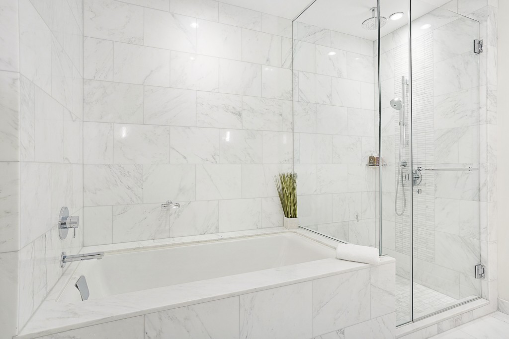 1 Franklin Street, Unit 3701 Boston, MA 02110 - Photo 13 of 26 a bathroom with a bathtub and shower