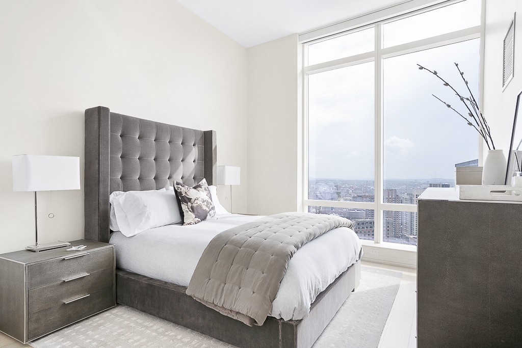 1 Franklin Street, Unit 3701 Boston, MA 02110 - Photo 14 of 26 a bedroom with a large bed and a balcony