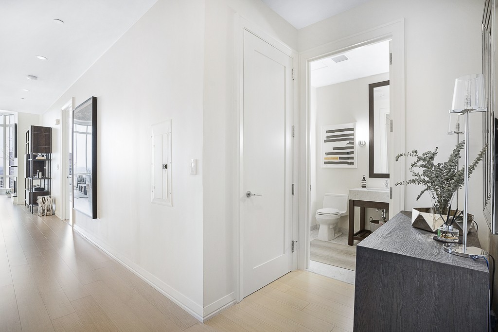 1 Franklin Street, Unit 3701 Boston, MA 02110 - Photo 16 of 26 a living room with furniture and wooden floor