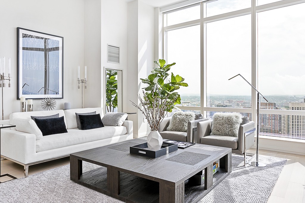 1 Franklin Street, Unit 3701 Boston, MA 02110 - Photo 2 of 26 a living room with furniture large window and wooden floor