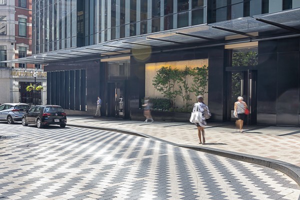 1 Franklin Street, Unit 3701 Boston, MA 02110 - Photo 21 of 26 a view of a patio with a table and chairs and potted plants
