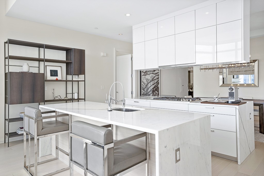 1 Franklin Street, Unit 3701 Boston, MA 02110 - Photo 4 of 26 a kitchen with a sink cabinets and wooden floor