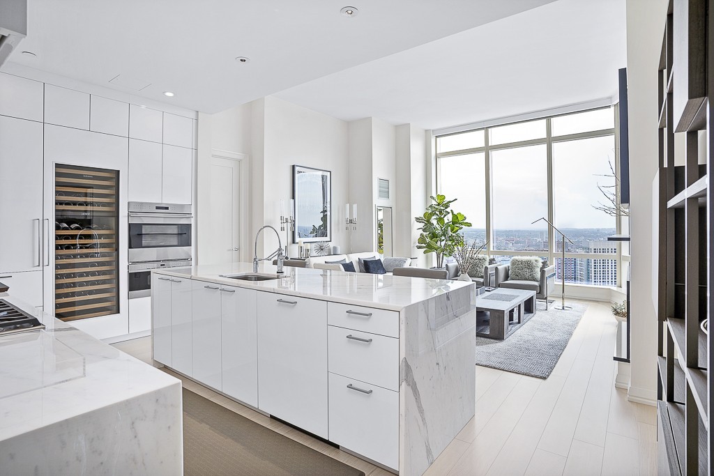 1 Franklin Street, Unit 3701 Boston, MA 02110 - Photo 6 of 26 a kitchen with a sink stove and cabinets