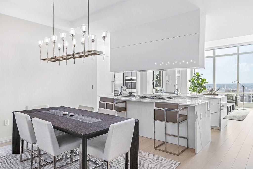 1 Franklin Street, Unit 3701 Boston, MA 02110 - Photo 7 of 26 a kitchen with a table and chairs in it