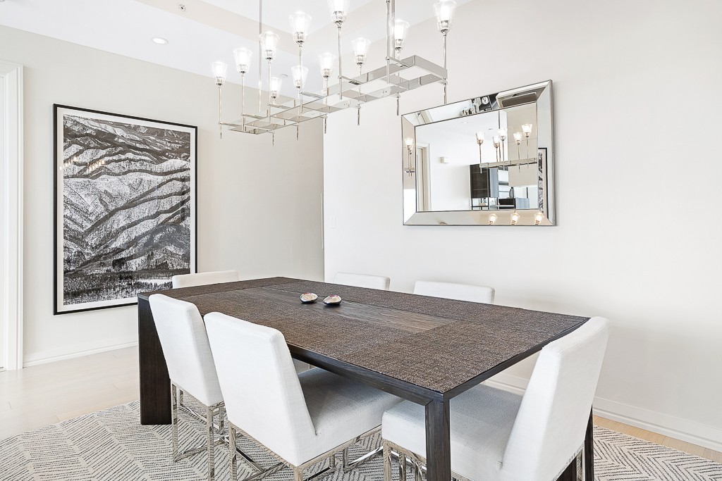 1 Franklin Street, Unit 3701 Boston, MA 02110 - Photo 8 of 26 a view of a dining room with furniture and chandelier