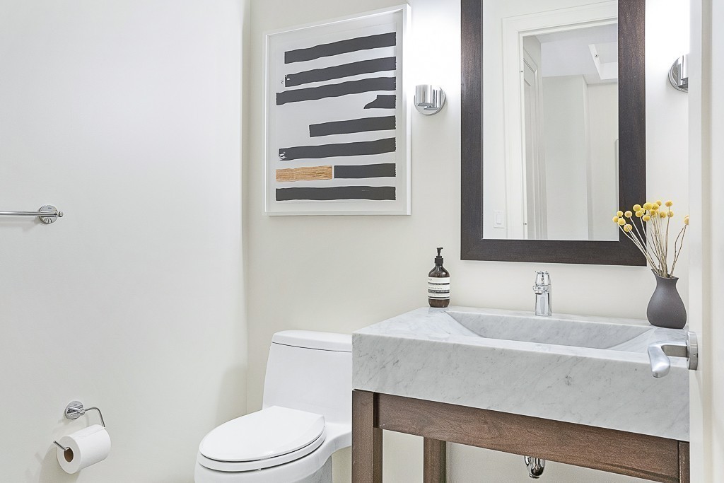 1 Franklin Street, Unit 3701 Boston, MA 02110 - Photo 9 of 26 a bathroom with a sink toilet and mirror