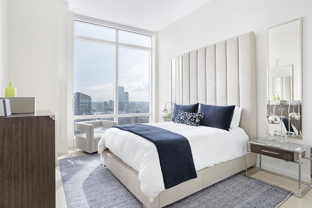 1 Franklin Street, Unit 3701 Boston, MA 02110 - Photo 10 of 26 a bedroom with a large bed and a large window