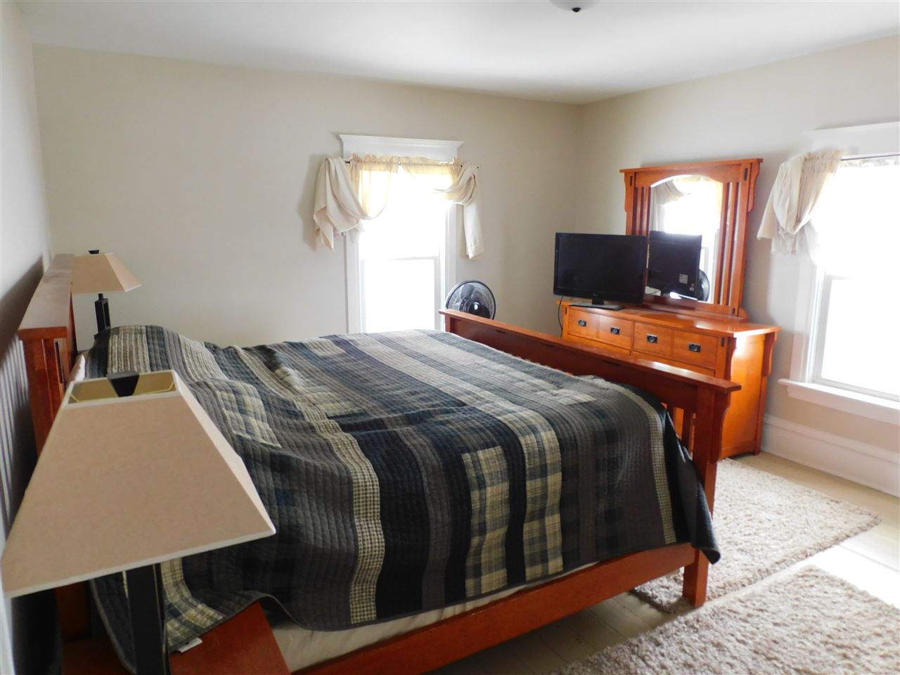 11669 Russellville Road Belvidere, IL 61008 - Photo 8 of 19 a bed sitting in a bedroom next to a window