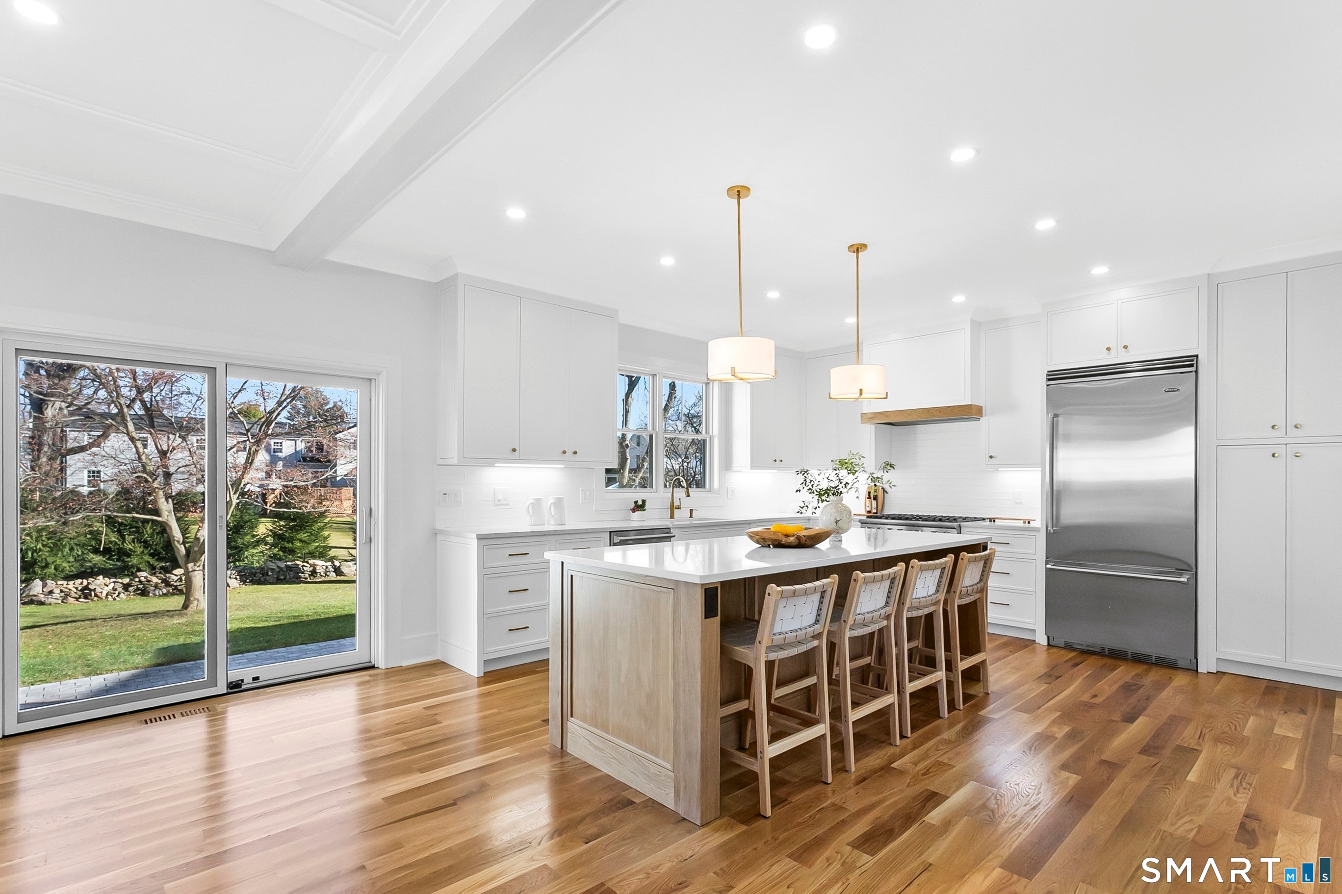 68 Figlar Avenue Fairfield, CT 06824 - Photo 4 of 40 Eat-in kitchen with sliders that open to backyard and patio.