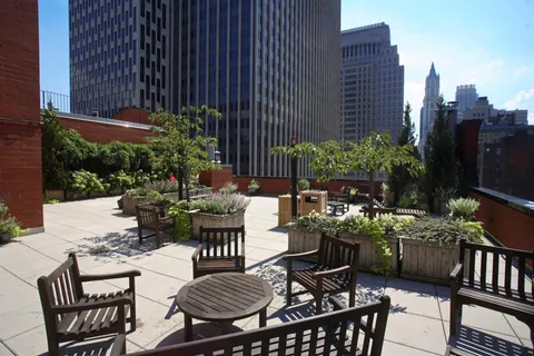 a view of a chairs and table in a patio