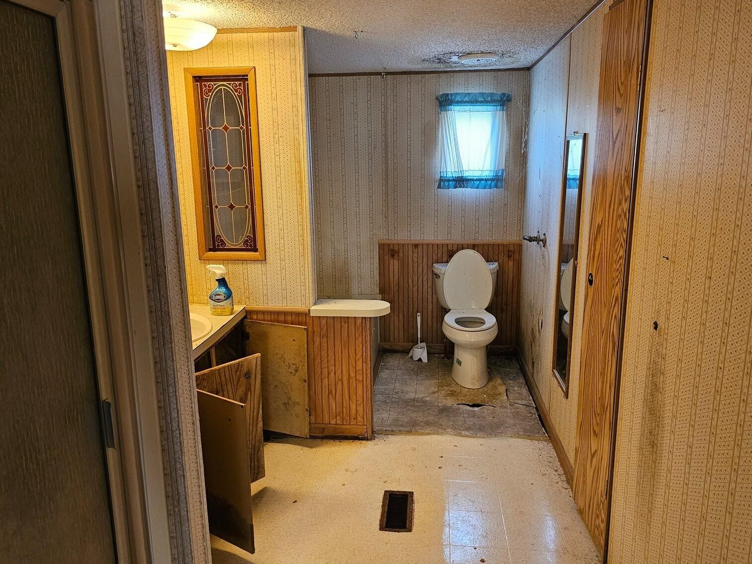 1810 Scuffling Hill Road Rocky Mount, VA 24151 - Photo 13 of 38 a bathroom with a sink and a toilet